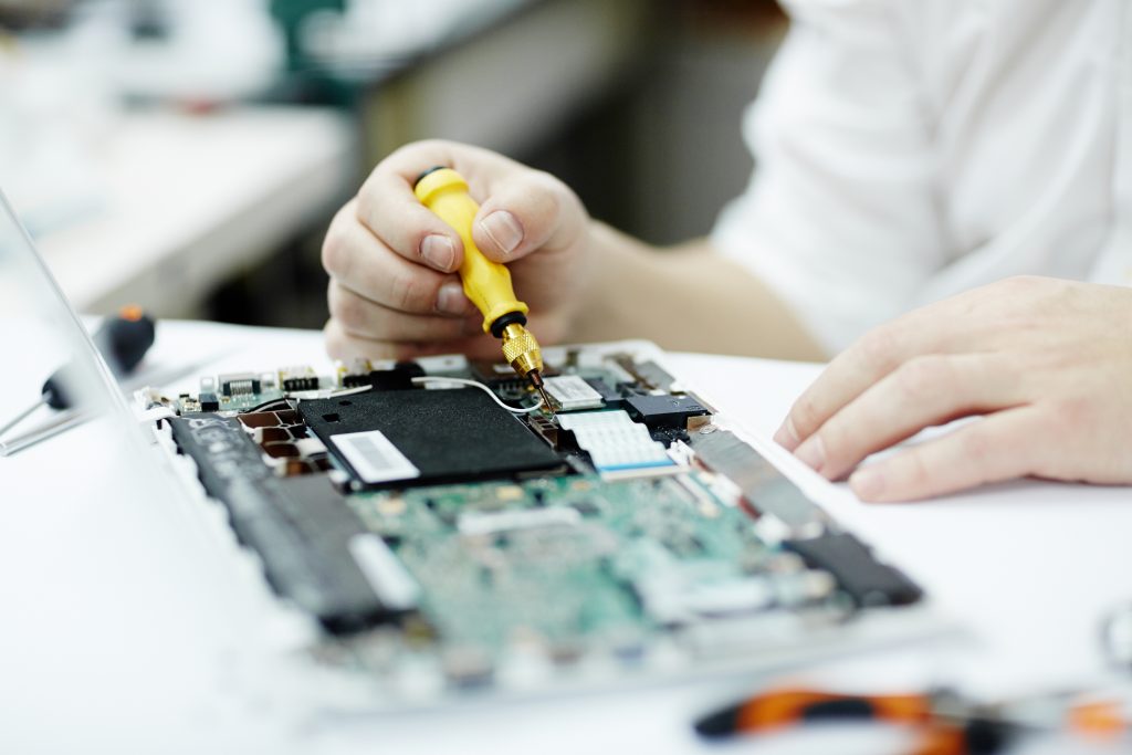 man working electronics